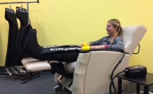 Ann Arbor recovery lounge with sports massage and NormaTec compression boots